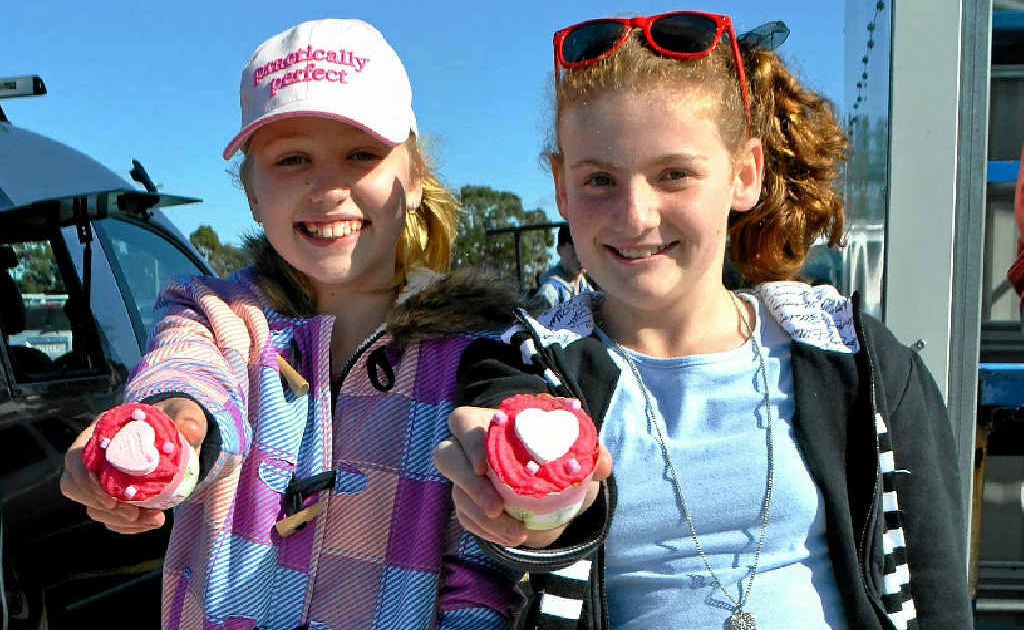 Maddie Farrell and Bonnie Howard spent their Saturday morning selling cupcakes. Maddie Farrell and Bonnie Howard spent their Saturday morning selling cupcakes.